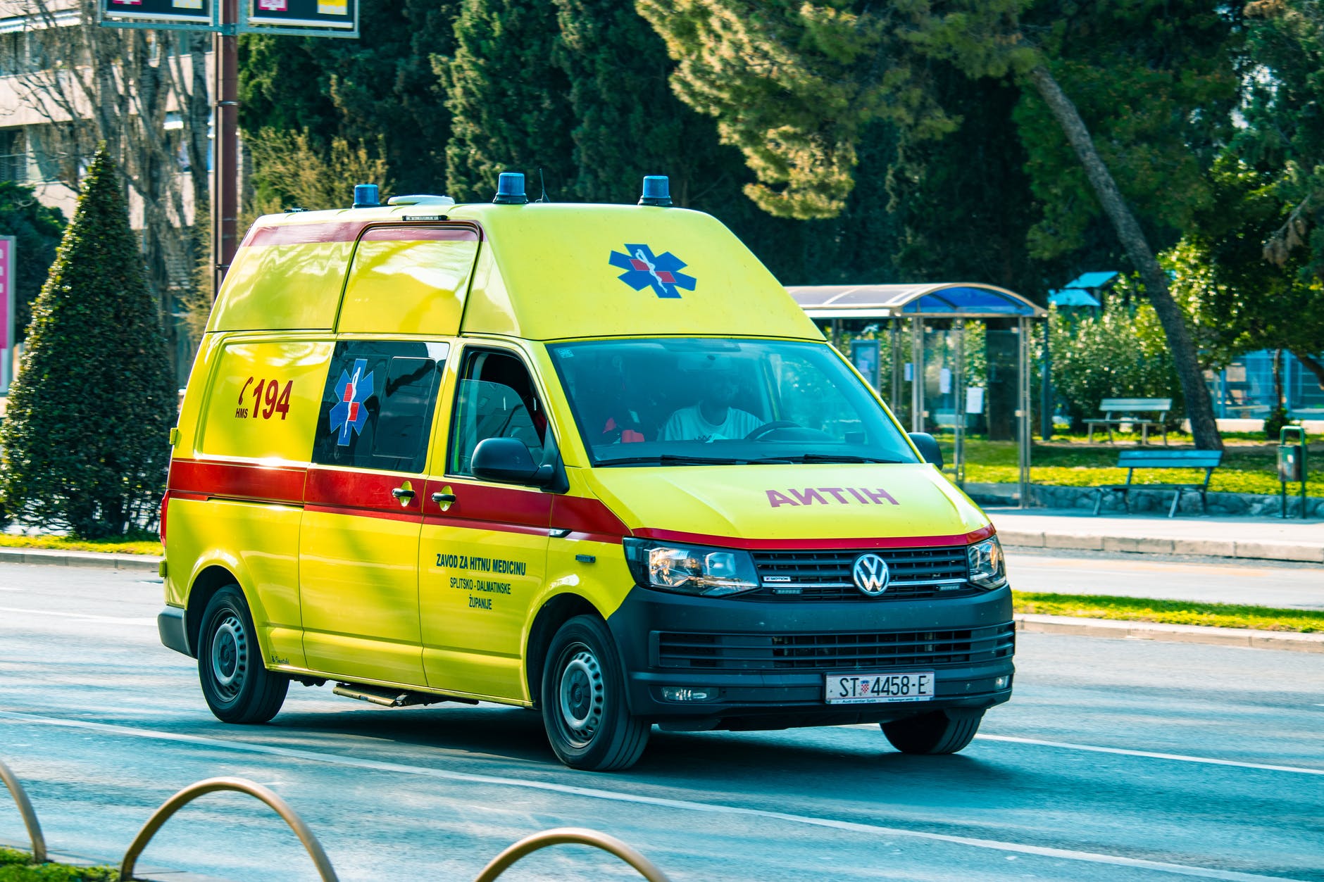 yellow and red motor vehicle on the road