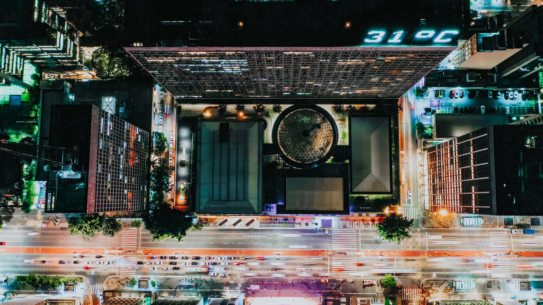 aerial view of a city street with electric lights